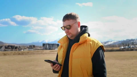 Caucasian man checking navigation map on mobile phone during travel trip. Stock Footage 340342429