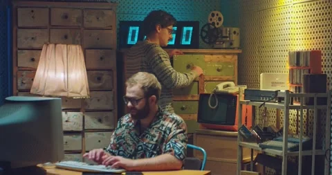 Caucasian man computer programist nerd in glasses sitting at vintage PC monitor Stock-Footage 135632517
