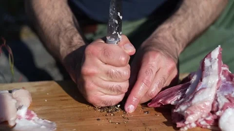 Caucasian man cooking on an open fire Stock Footage 275049728