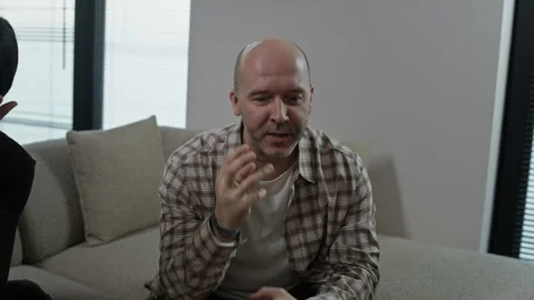 Caucasian Man Discussing Marriage Problems with Phycologist Emotionally Stock Footage 334726296