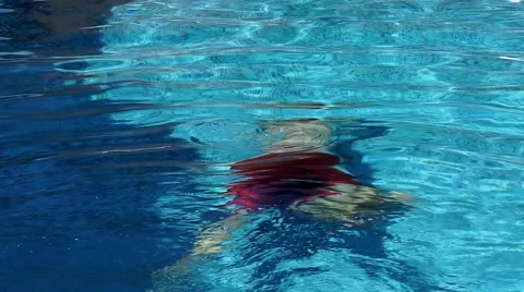 Caucasian man diving in a pool Stock Footage 60691776