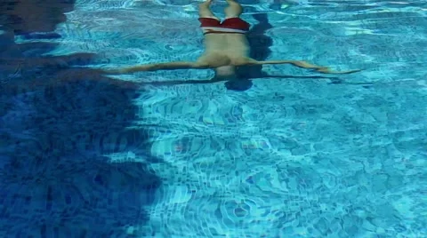 Caucasian man diving in a pool Stock Footage 60691853