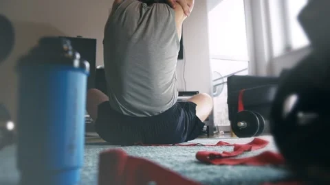 Caucasian man is doing stretching training and relaxing workout at home. Stock Footage 147872344