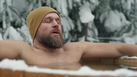 Caucasian man during the winter bath in tube outdoors Stock-Footage 230903633