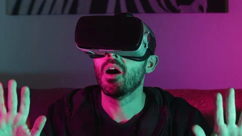 Caucasian man exploring virtual augmented reality in the Metaverse Stock Footage 165685601