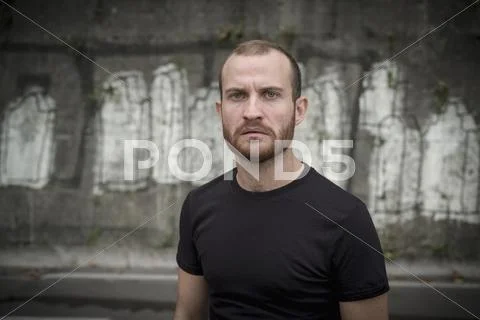 Caucasian man frowning outdoors Stock Photos