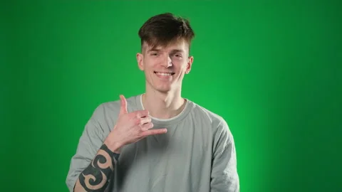 Caucasian man gesturing with shaka hand sign Stock Footage 224788465