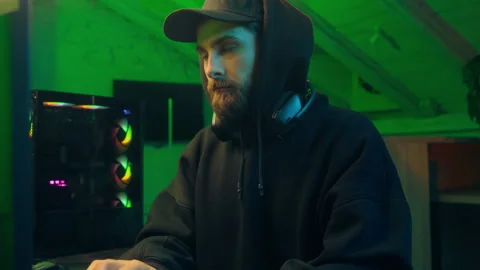 Caucasian man hacker computer looking at camera programming pc scam networking Stock Footage 285816808