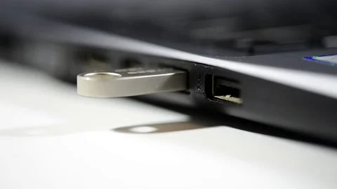 Caucasian man hand pulls out usb pen drive Stock Footage 100138503