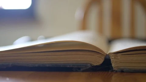 Caucasian man hand turning the aged old yellow book pages Stock Footage 115688981