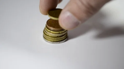 Caucasian man hands builds a stack of coins Stock Footage 110830284