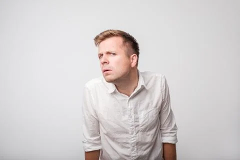 Caucasian man having hearing problem listening to something Stock Photos