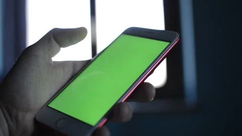 Caucasian man hold iphone device with green screen display. Video stock 236978504