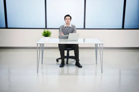 A caucasian man lab techncian working in the office of a computer server farm. Stock Photos