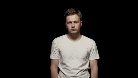 Caucasian man looking at camera. Black isolated background Stock Footage 110993452