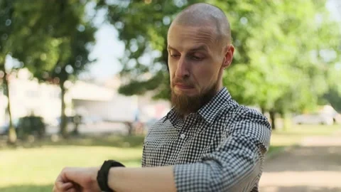 Caucasian man looking at his clock Stock Footage 157992355