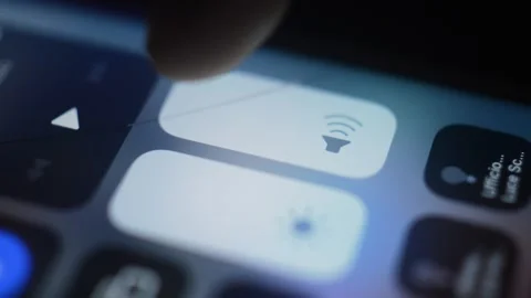 Caucasian man mute the volume setting of his iphone. iphone mute. 스톡 동영상 236982134
