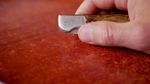 Caucasian man opens then closes a pocket knife Stock Footage 113259455