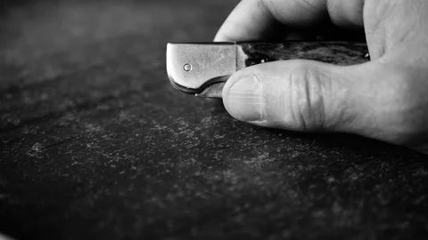 Caucasian man opens then closes a pocket knife Stock Footage 113259459