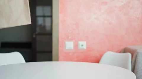 Caucasian man picks it up from the table a paper craft bag Stock Footage 270721054