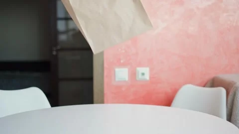 Caucasian man picks it up from the table a paper craft bag Stock Footage 270721056