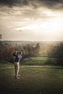 Caucasian man playing golf Photos