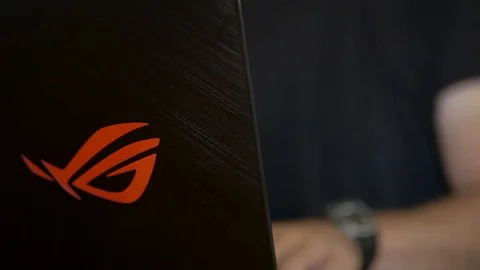 Caucasian man playing, working on Asus Rog laptop Stock Footage 114650180