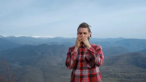 Caucasian man plays melody on harmonica Stock Footage 238895133
