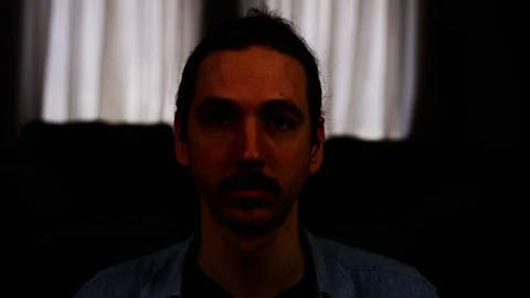 A caucasian man puts on a protective face mask - Medium Shot - slow motion Stock Footage 129718447