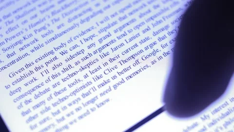 Caucasian man read an ebook on the iphone reader app. ebook reader. Stock-Footage 229638467