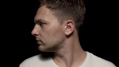 Caucasian man rotating head left to center. Close up shot. Stock Footage 110993975