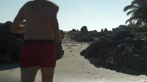 Caucasian man running on the beach Vidéo 45993507