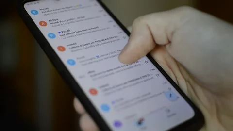 Caucasian man scrolling e mail on his phone, phone e mail telecommunication Video stock 170884456