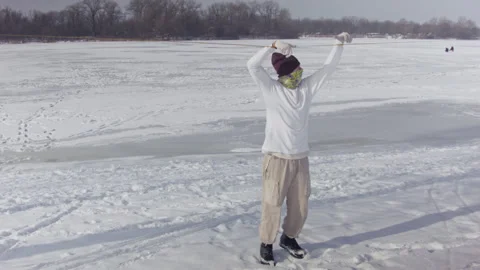 Caucasian man sets slackline between trees in the winter forest. Stock Footage 148165169