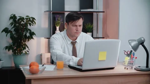 Caucasian man sits down at the workplace and turns on the computer. Business 스톡 동영상 146707328