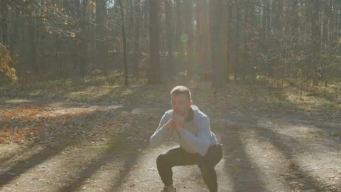 Caucasian Man Is Squatting Outdoor Stock Footage 166350853