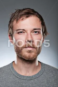 Caucasian man with a squinty eyed stare down Stock Photos