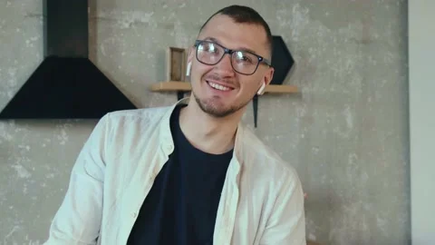 Caucasian man is thinking about something and smiling at camera wearing glasses Stock Footage 155320298