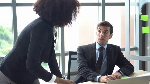 Caucasian man in trouble having problem with his female boss Stock Footage 113552667