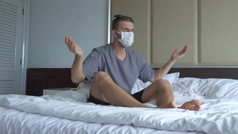 Caucasian man trying to cope with going stir-crazy during self-quarantine Stock Footage 158809636