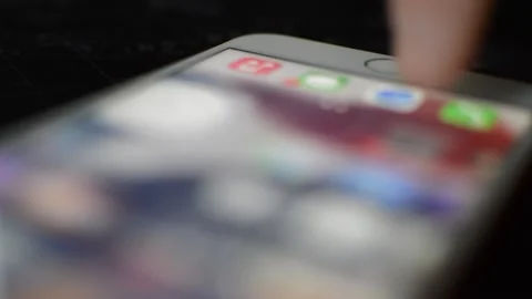 Caucasian man unlock iphone with touch id. iphone display swipe. Stock Footage 239315885