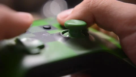 Caucasian man use xbox controller joypad for video game in blur background. 스톡 동영상 279890035