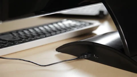 Caucasian man using computer connecting and disconnecting USB cord Stock Footage 194100920
