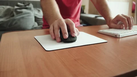Caucasian man using computer mouse at table at home. Stock Footage 330541911