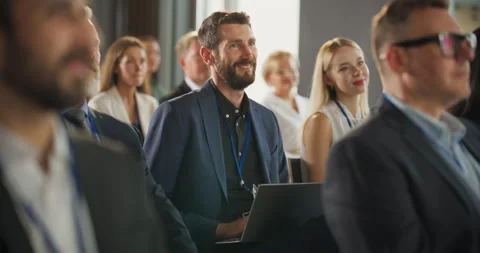 Caucasian Man Using Laptop At Crowded Business Conference Stock Footage 255841111