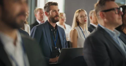 Caucasian Man Using Laptop At Crowded Business Conference Stock Footage 255841147