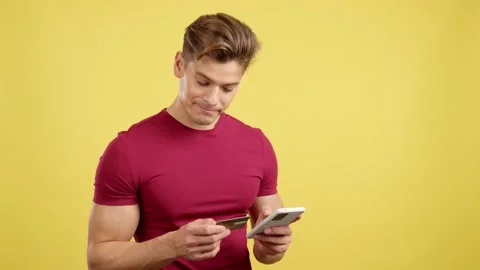 Caucasian man using the mobile and card to shopping online Vídeo Stock 234913834