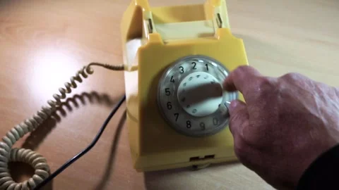 Caucasian man using an old analog telephone Stock Footage 313221988