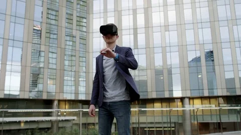 Caucasian man Using Virtual Reality outside Stock Footage 73746846