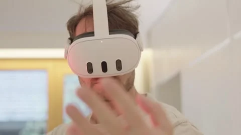 Caucasian man using a virtual reality headset, touching and swiping in the air Stock-Footage 335268338